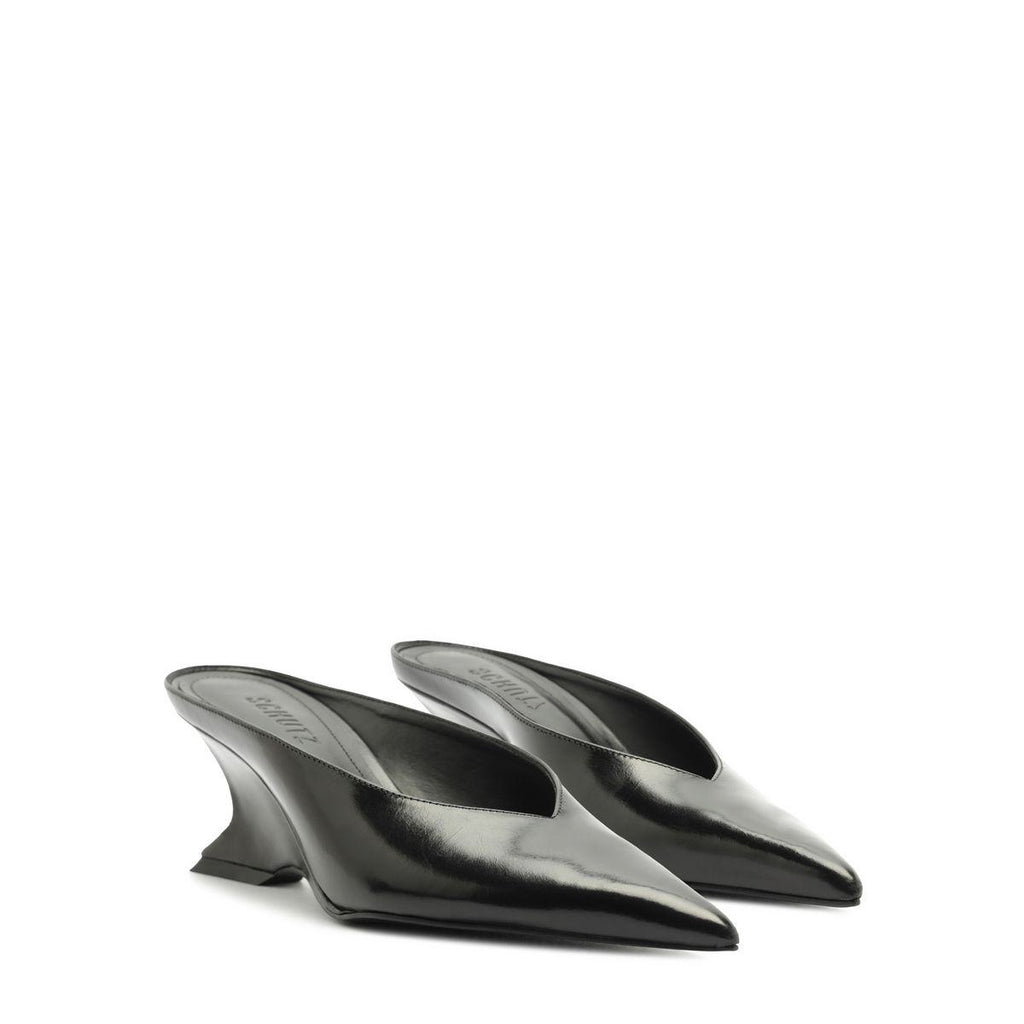 Side view of black Siena mid mule pumps showcasing pointed toes and sculptural heels on a white background