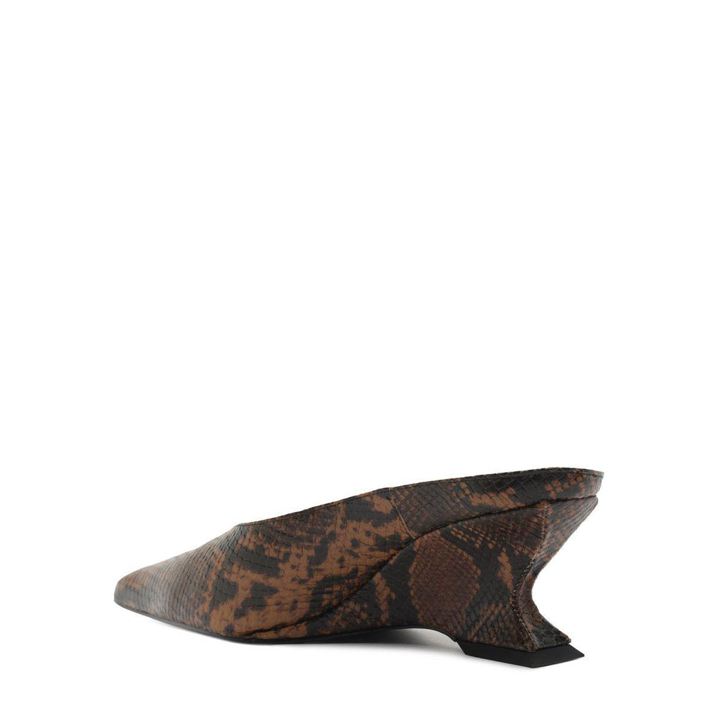 Side view of Siena Mid Mule Pump in Animal Print showcasing pointed toe and sculptural heel against a white background