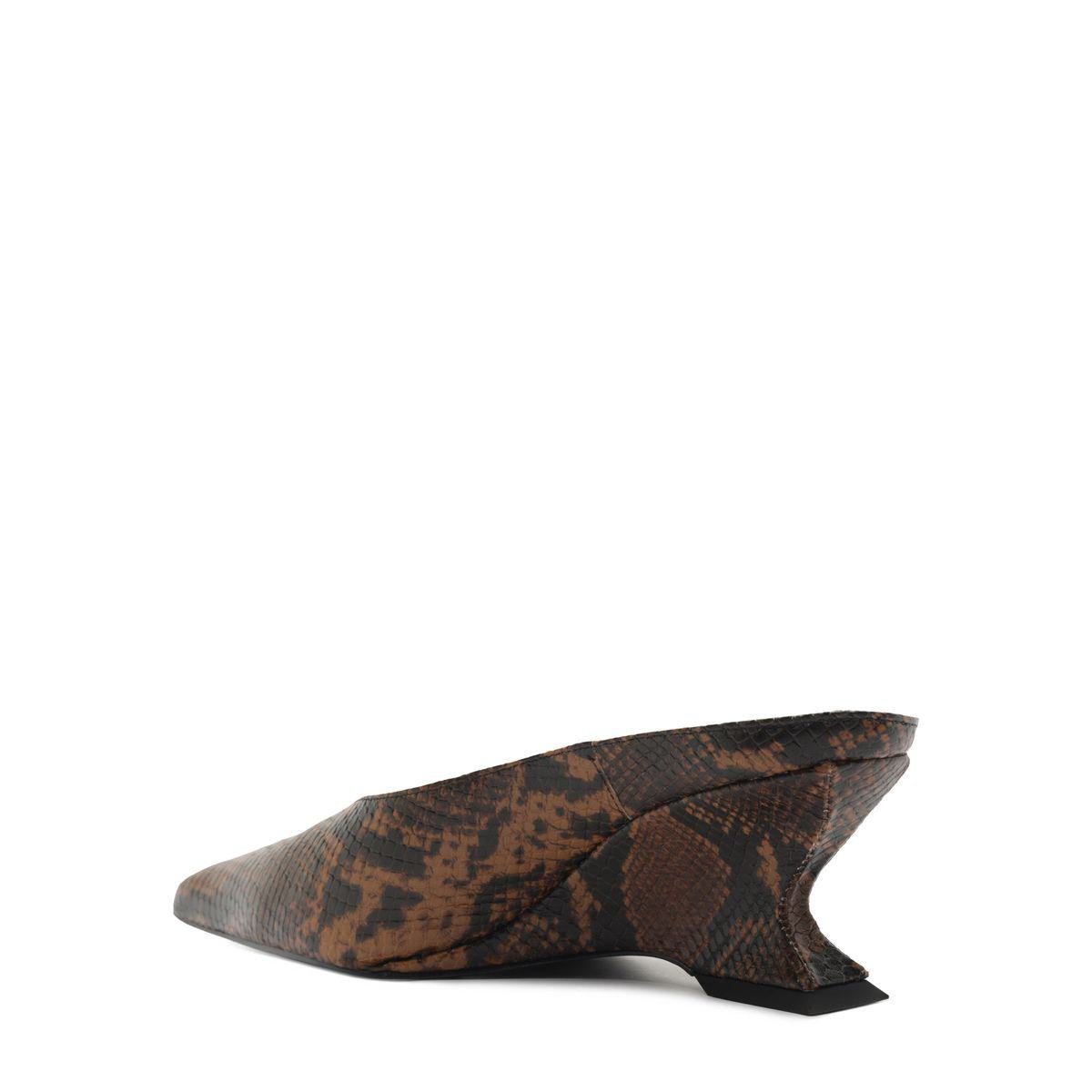 Side view of Siena Mid Mule Pump in Animal Print showcasing pointed toe and sculptural heel against a white background