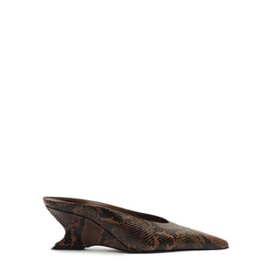 Side view of Siena mid mule pump showcasing animal print and sculptural wedge heel on a white background