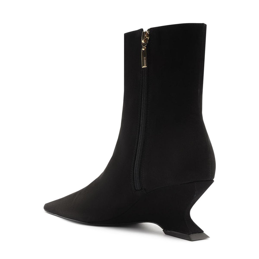 Side view of black Siena mid bootie showcasing pointed toe, zip closure, and wedge heel with white background