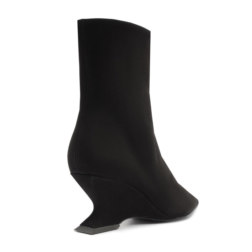 Side view of Siena Mid Bootie in black showcasing its mid-height wedge heel and pointed toe on a white background