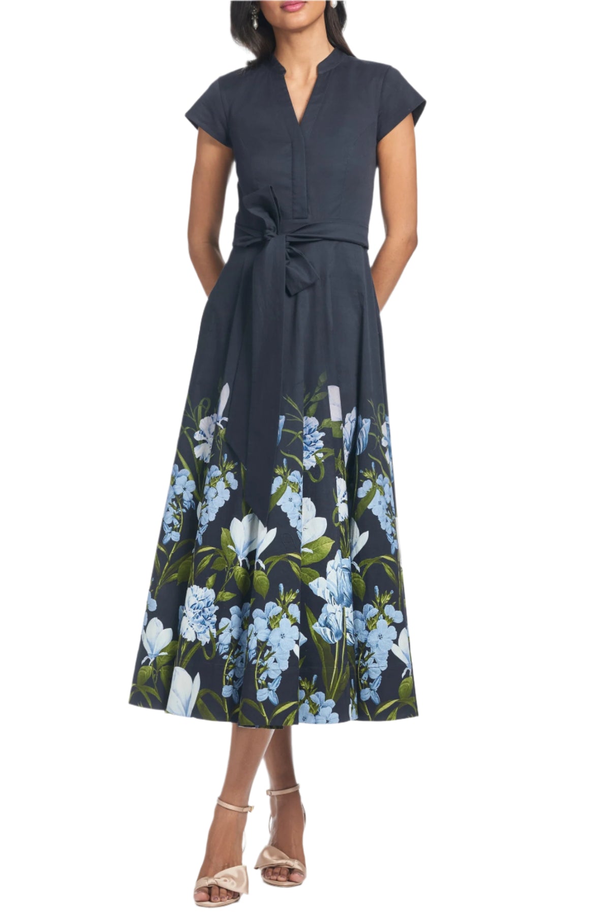 Front view of Ganika Dress in Night Sky Prima Garden with banded collar, self tie belt, pockets, and floral print on white