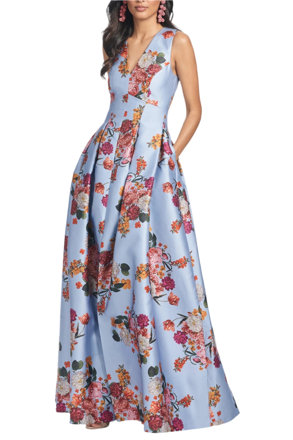 Front view of Brooke Gown Glacial Blue Bright Bouquet showcasing fitted bodice, V neck, floral print and pockets on model