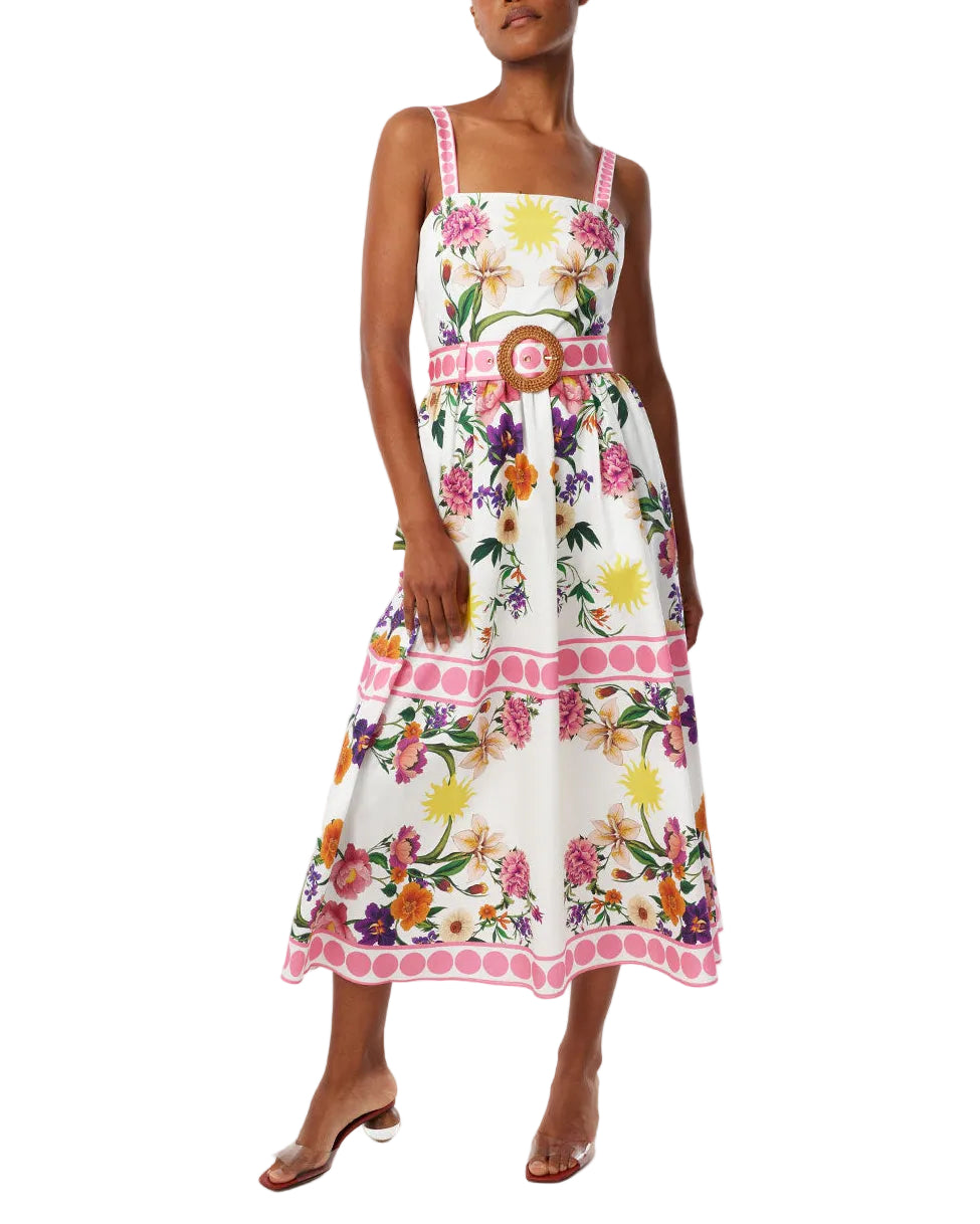 Front view of Ninet cotton dress in Botanica with square neckline, belted waist, and floral midi skirt on white