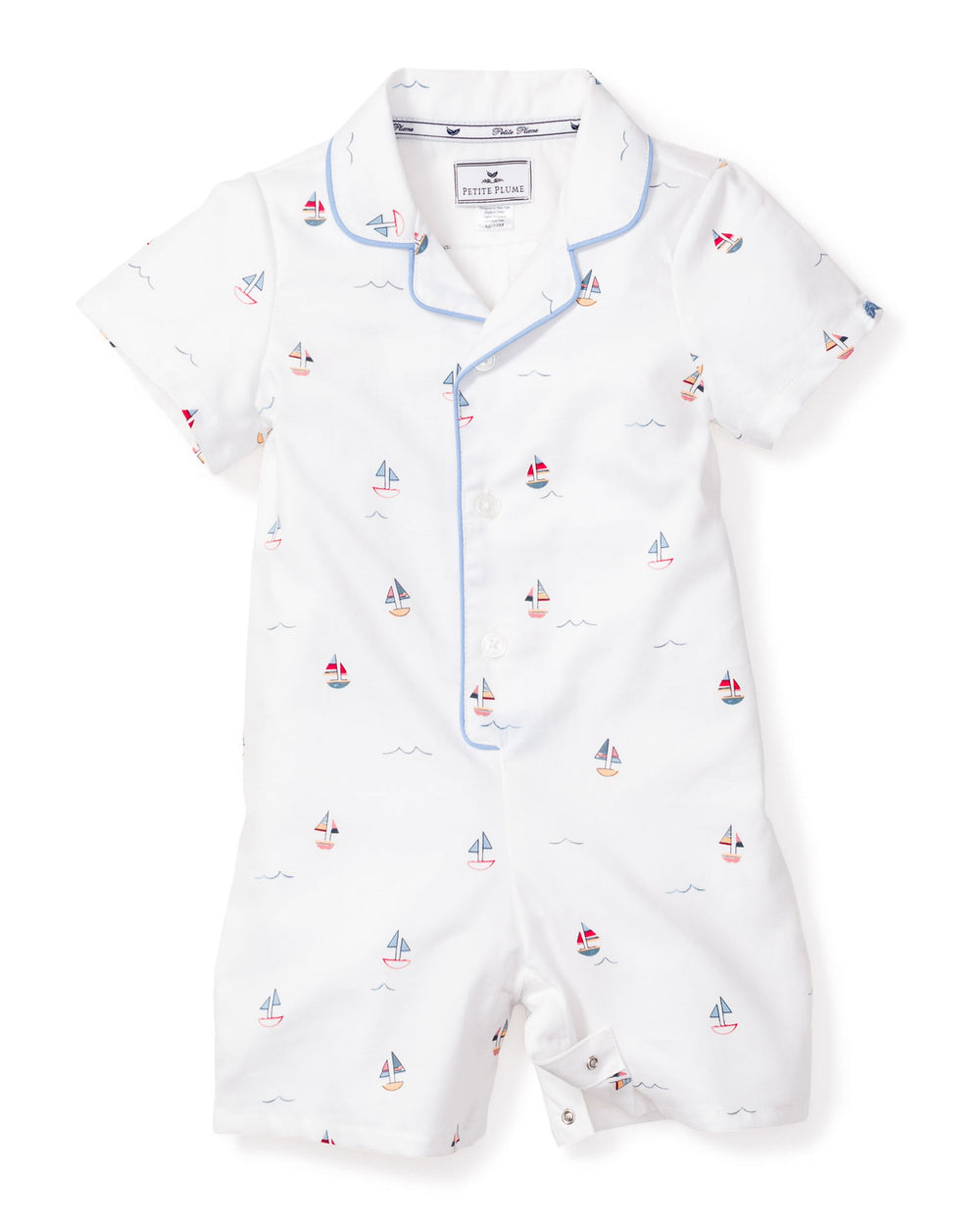 Flat lay of Baby’s Twill Summer Romper in Bateau with sailboat print, blue piped collar, short sleeves, front buttons and snap crotch