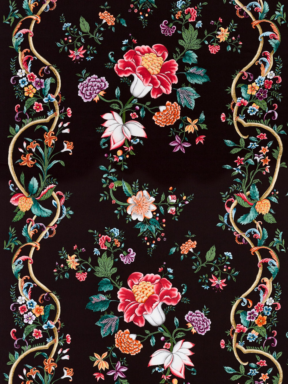 Flat lay of Camellia Trellis fabric in Onyx Ruby showcasing large red camellias and colorful floral trellis on a black background