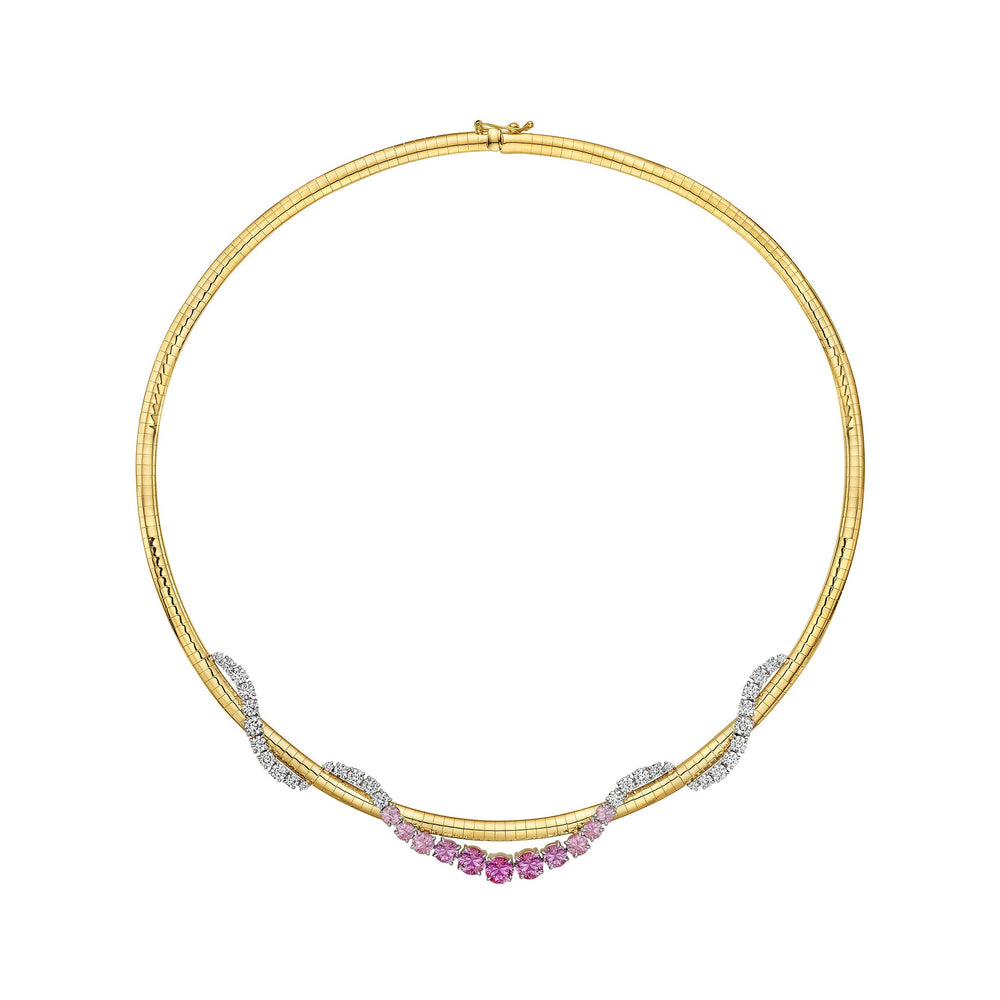 A rigid, circular necklace in yellow gold and platinum, the Pink Coil Graduated Round Sapphire and Diamond and Omega Chain Necklace features symmetrically arranged clusters of pink sapphires interspersed with sections of white diamonds along its lower half.