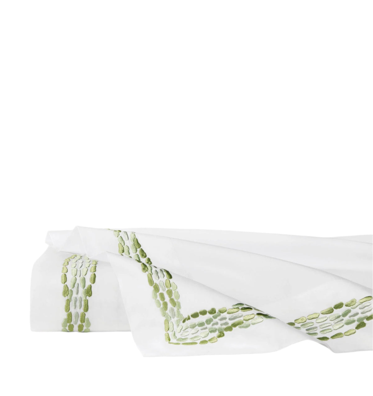 Folded Cobblestones flat sheet showcasing green cobblestone-style embroidered border on white background