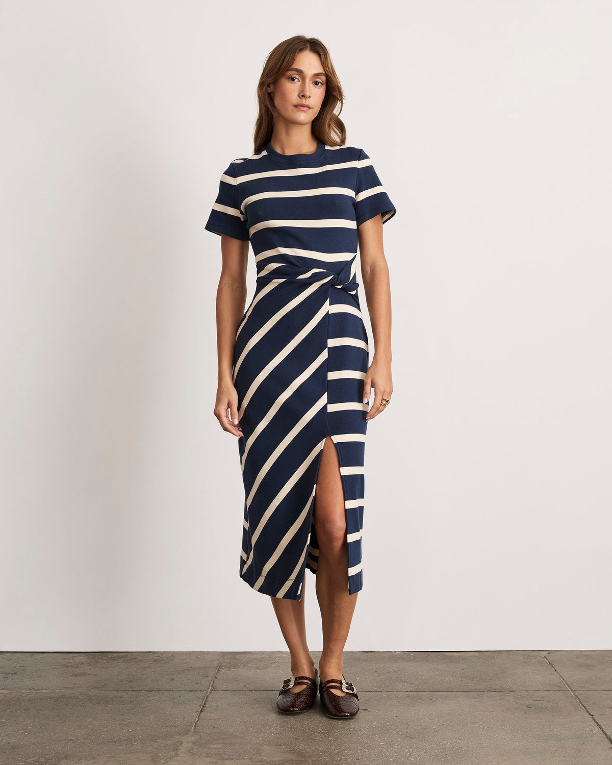 Front view of Short Sleeve Cody midi dress in Maritime Blue and Cream wide stripe with twist knot waist and side slit