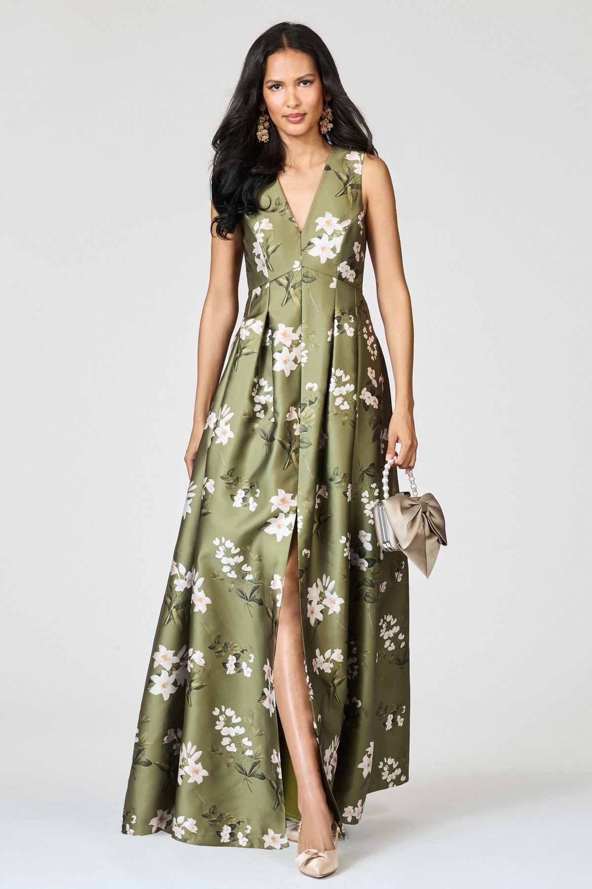 Front view of Brooke Gown in Moss Formosa on a model, showing its floral print, V-neckline, peaked waist, and front slit