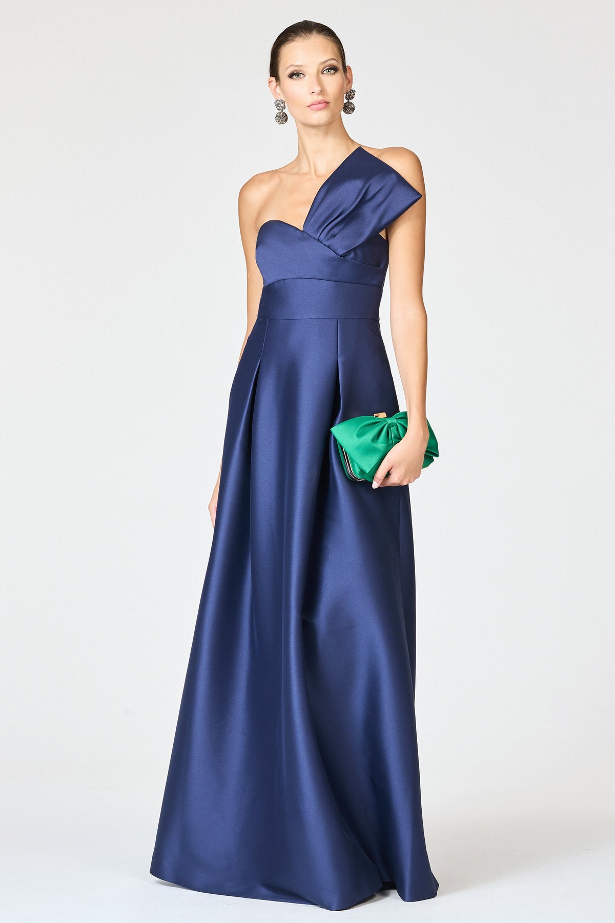 Front view of Stephie Gown in Night Sky showcasing its pleated A-line skirt and wide waistband on a model