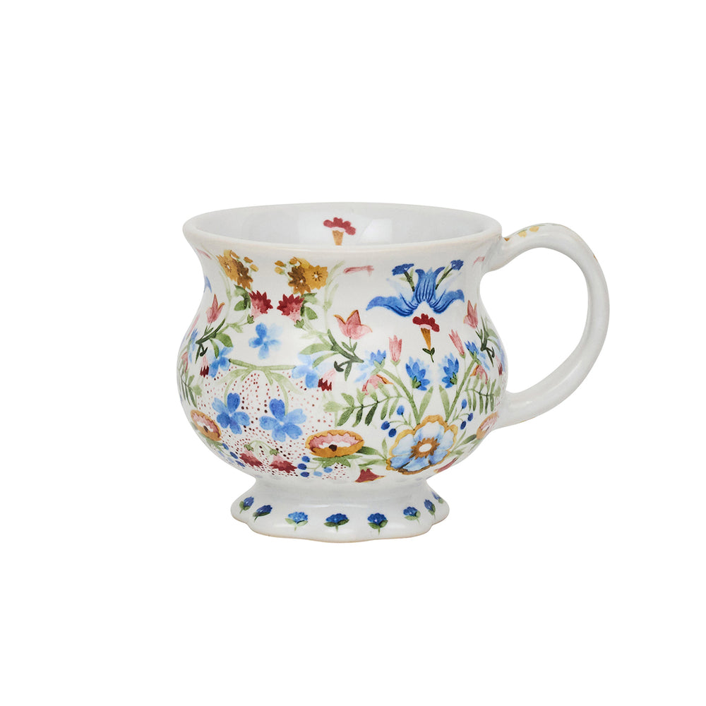 Front view of Sofia Mug in Multi with painted floral pattern, scalloped pedestal foot, and curved handle on white background