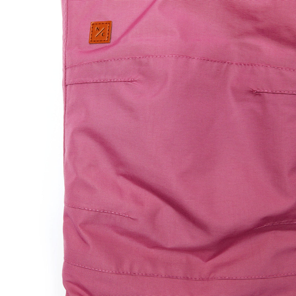 Kids pink snow bib pants with adjustable straps, waterproof fabric, and reinforced knees for winter play and ski for girls