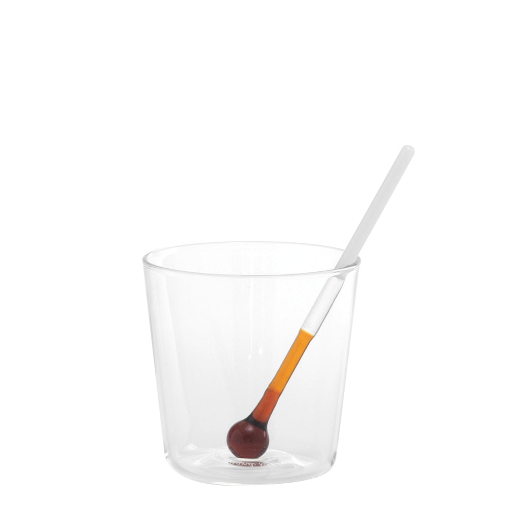 Front view of Spritzometro tumbler showcasing matching amber-tipped glass stirrer inside on white background