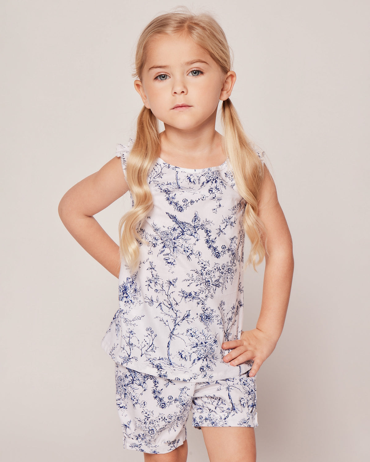 Front view of Girl’s Twill Amelie Short Set in Timeless Toile showcasing its toile print and ruffled straps on a neutral background