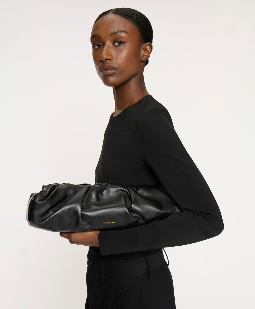 Front view of Cloud Baguette in Black showcasing its elongated sculptural silhouette against a white background
