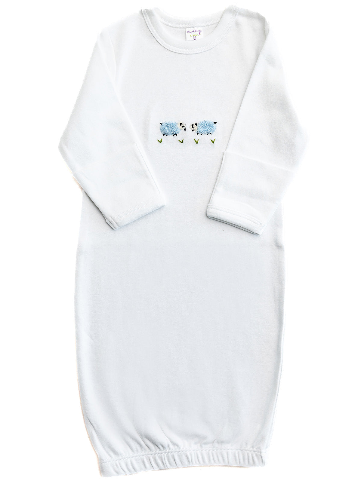 White baby gown with floral embroidery on a white background