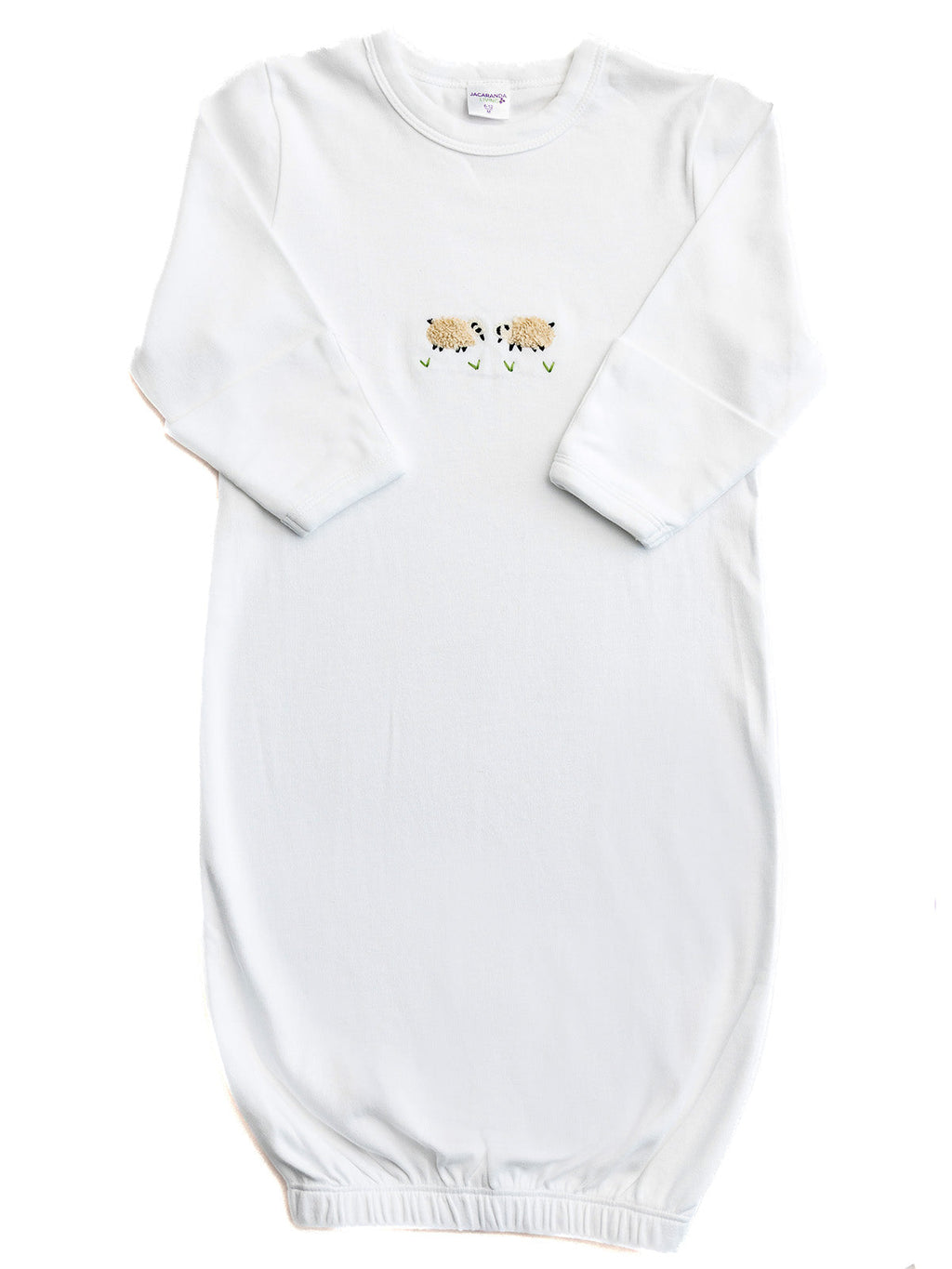 White baby gown with lion embroidery on a white background