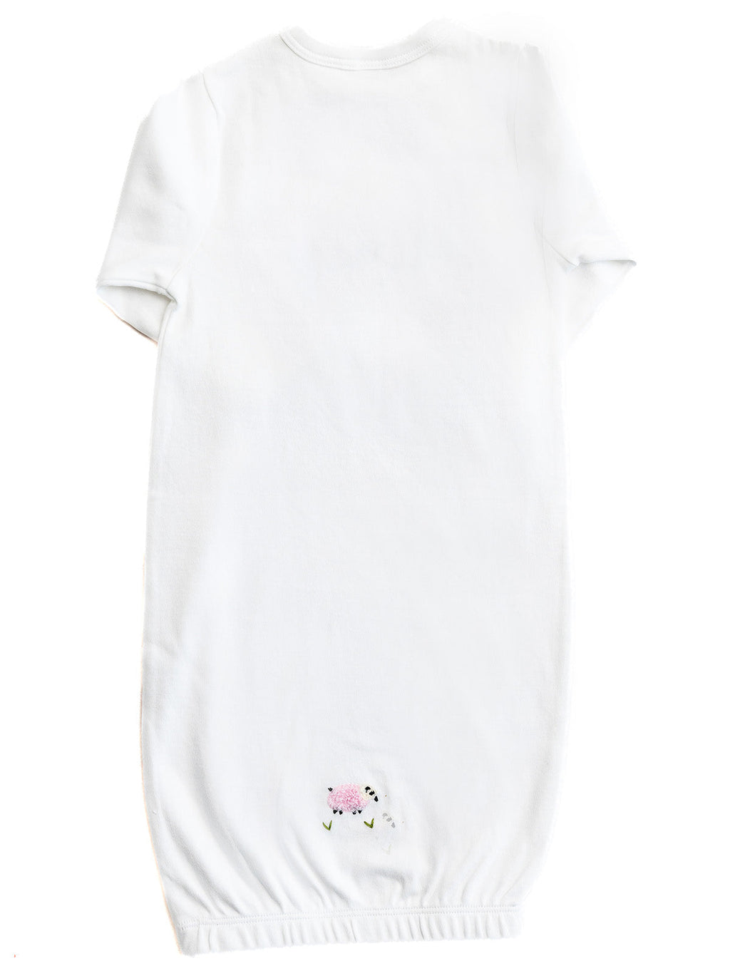 White baby romper with floral embroidery on a white background