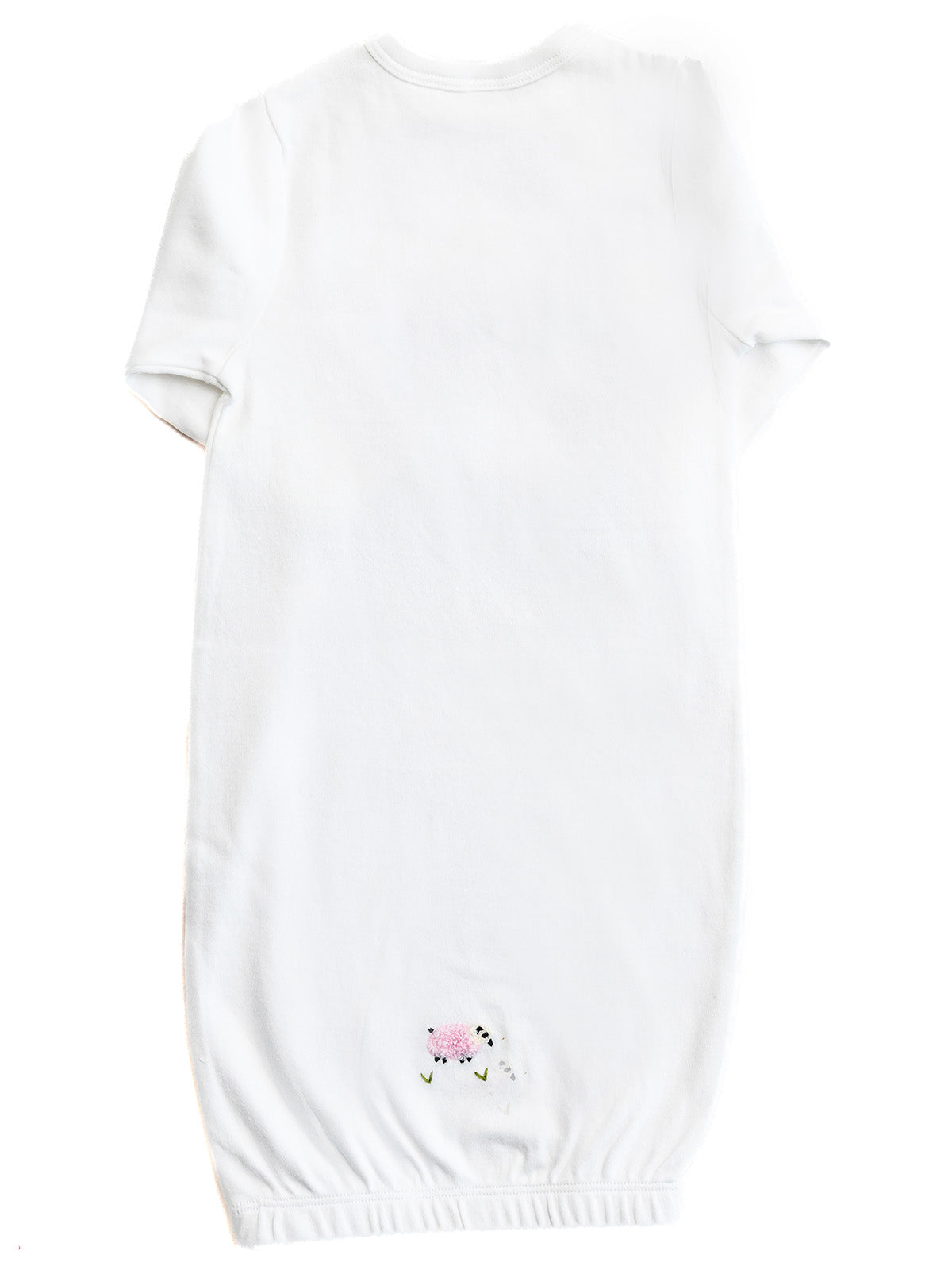 White baby romper with floral embroidery on a white background