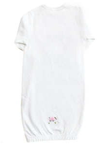 White baby romper with floral embroidery on a white background
