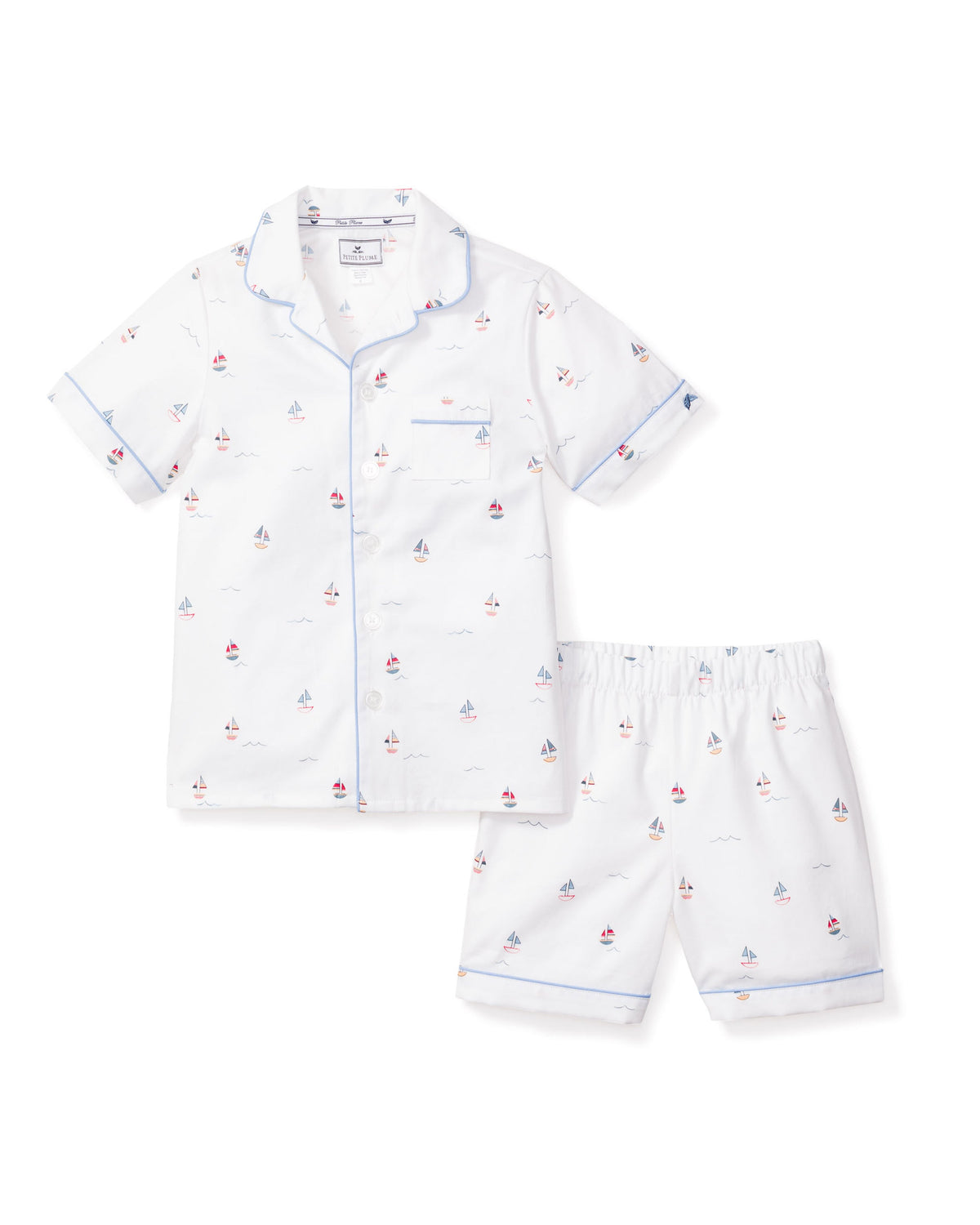 Front view of Kid’s Twill Pajama Short Set in Bateau showcasing sailboat print, contrast piping, and pearl buttons on white background