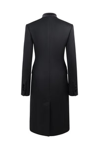 Back view of Safi Coat in Black showcasing its tailored silhouette and below-knee length against a white background