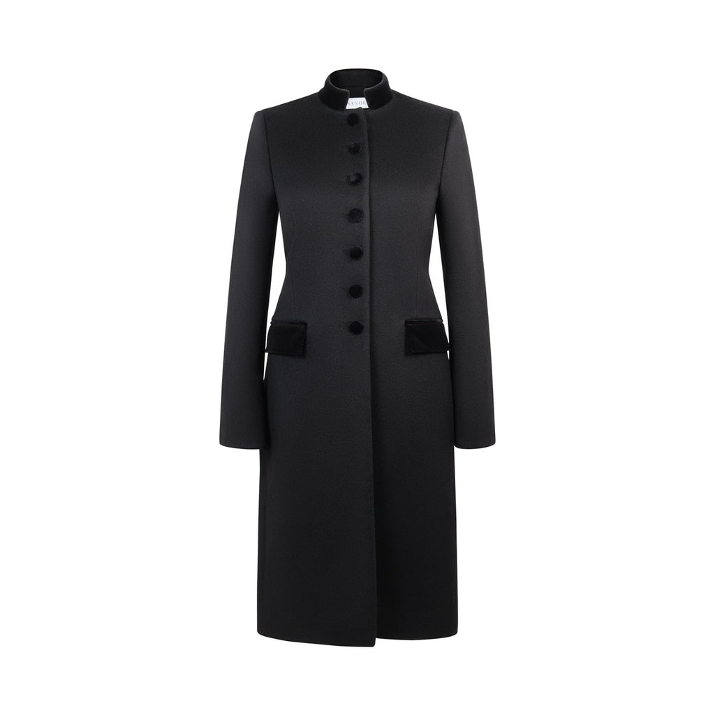 Front view of Safi Coat in Black showcasing its tailored silhouette, velvet collar and pockets against a white background