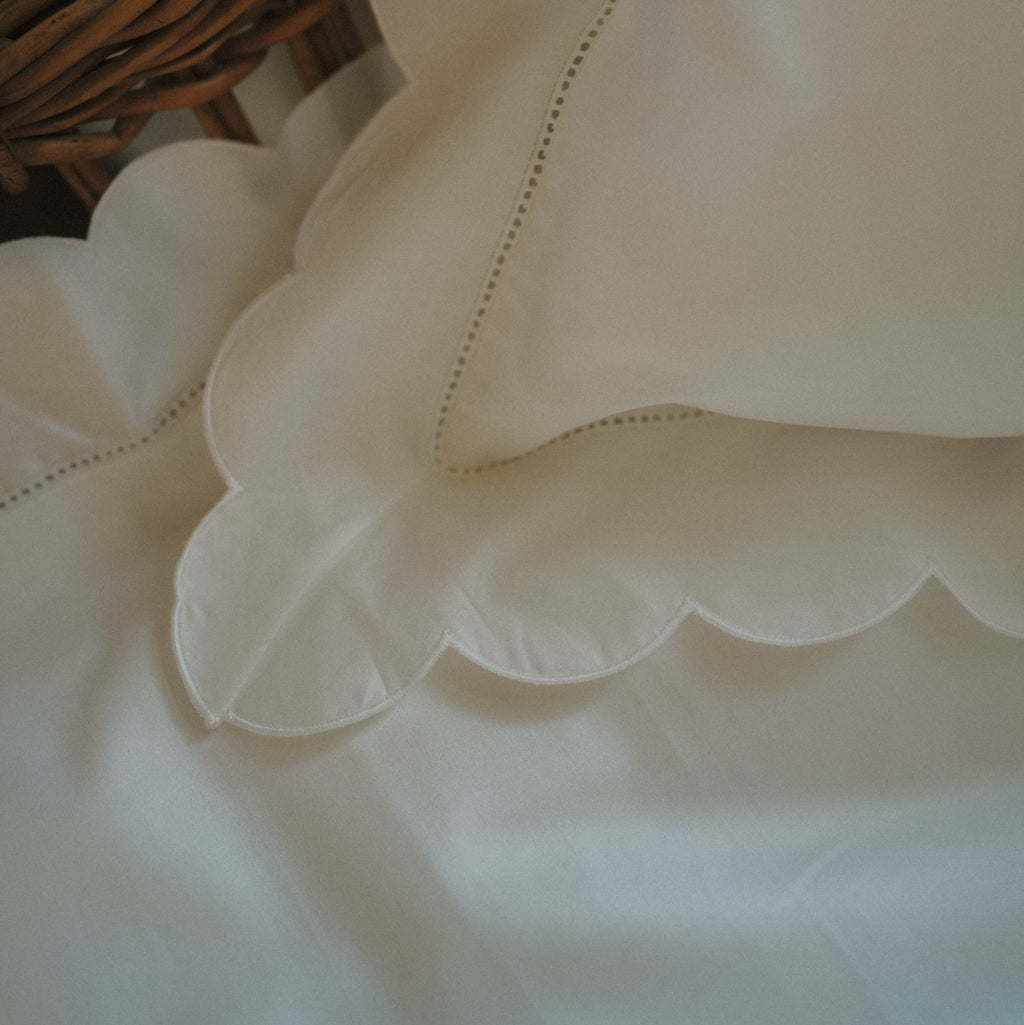 Scalloped Starlight Toddler Pillowcase in White corner detail of scallop and embroidery