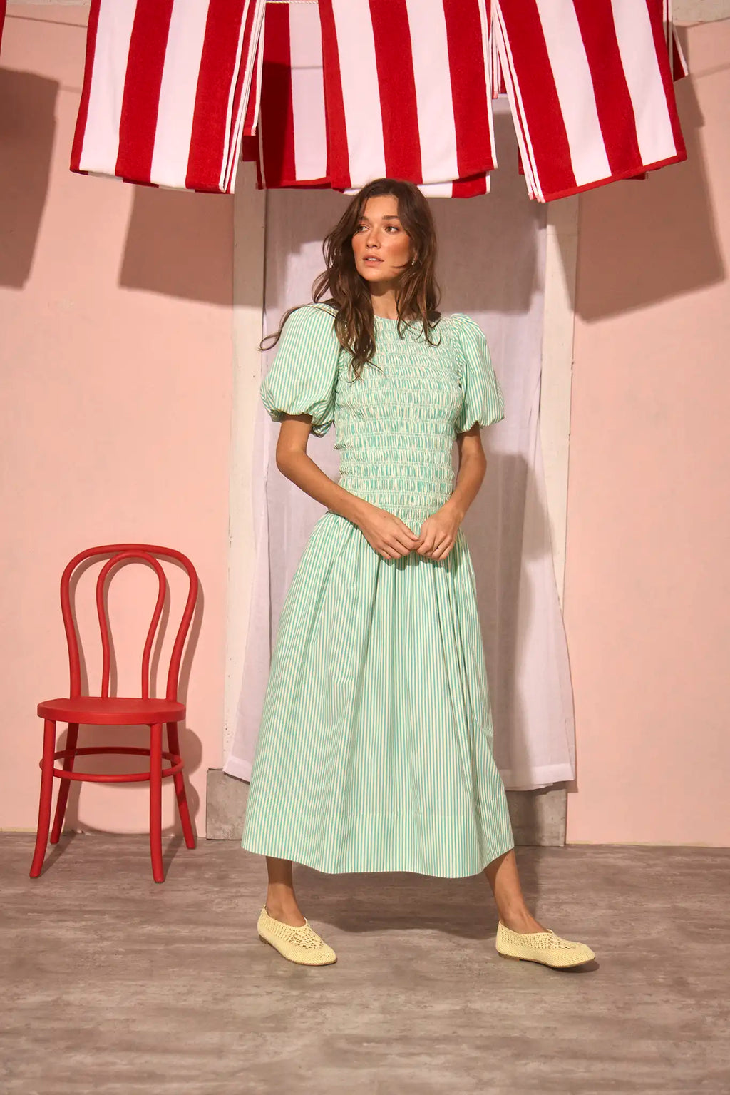 The Scarlet Dress in Saltwater paired with pale yellow shoes.