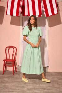 The Scarlet Dress in Saltwater paired with pale yellow shoes.