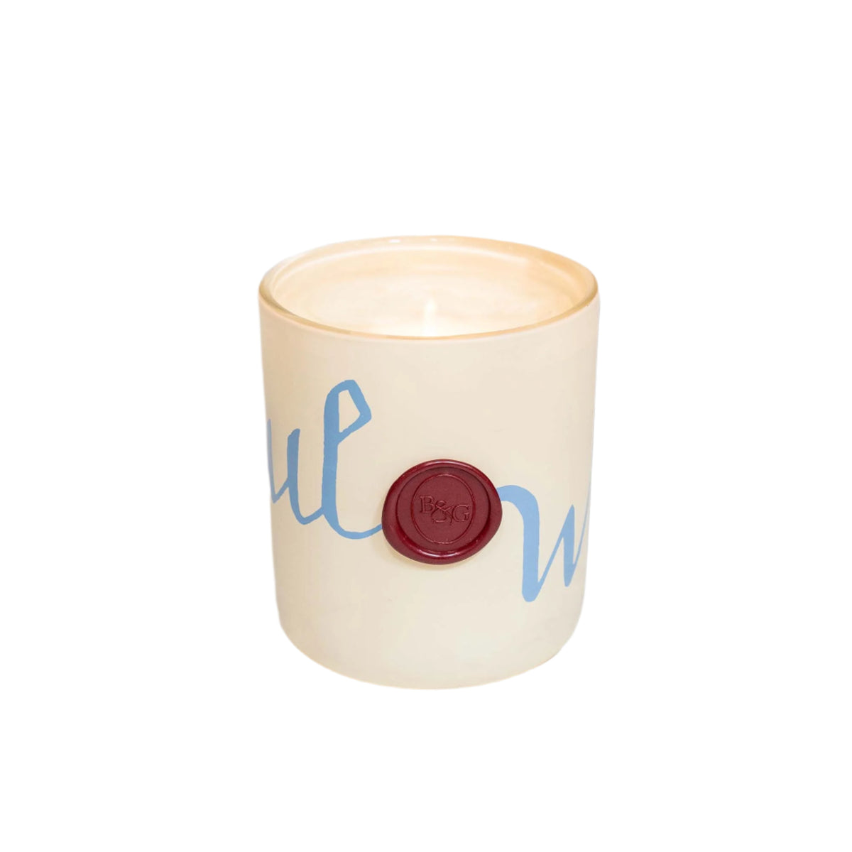 Front view of Everwonder candle in cream ceramic jar showcasing pale blue script design and red wax seal on white background