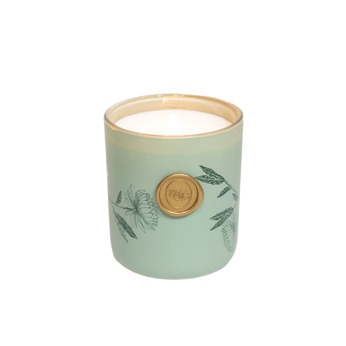 Front view of Moorland Breeze candle in pale green ceramic jar with floral print and gold medallion on white background