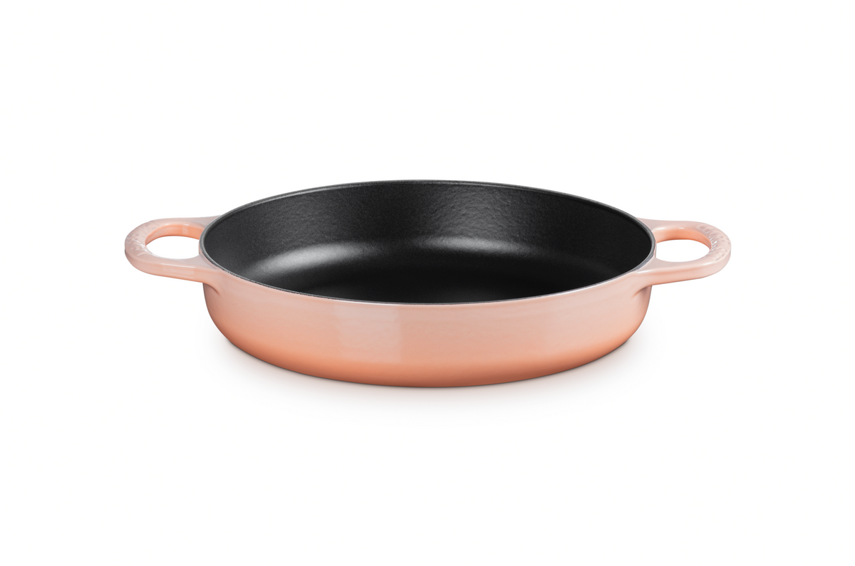Front three-quarter view of Signature Everyday Pan in Peche showcasing its wide cooking surface and two side handles against a white background