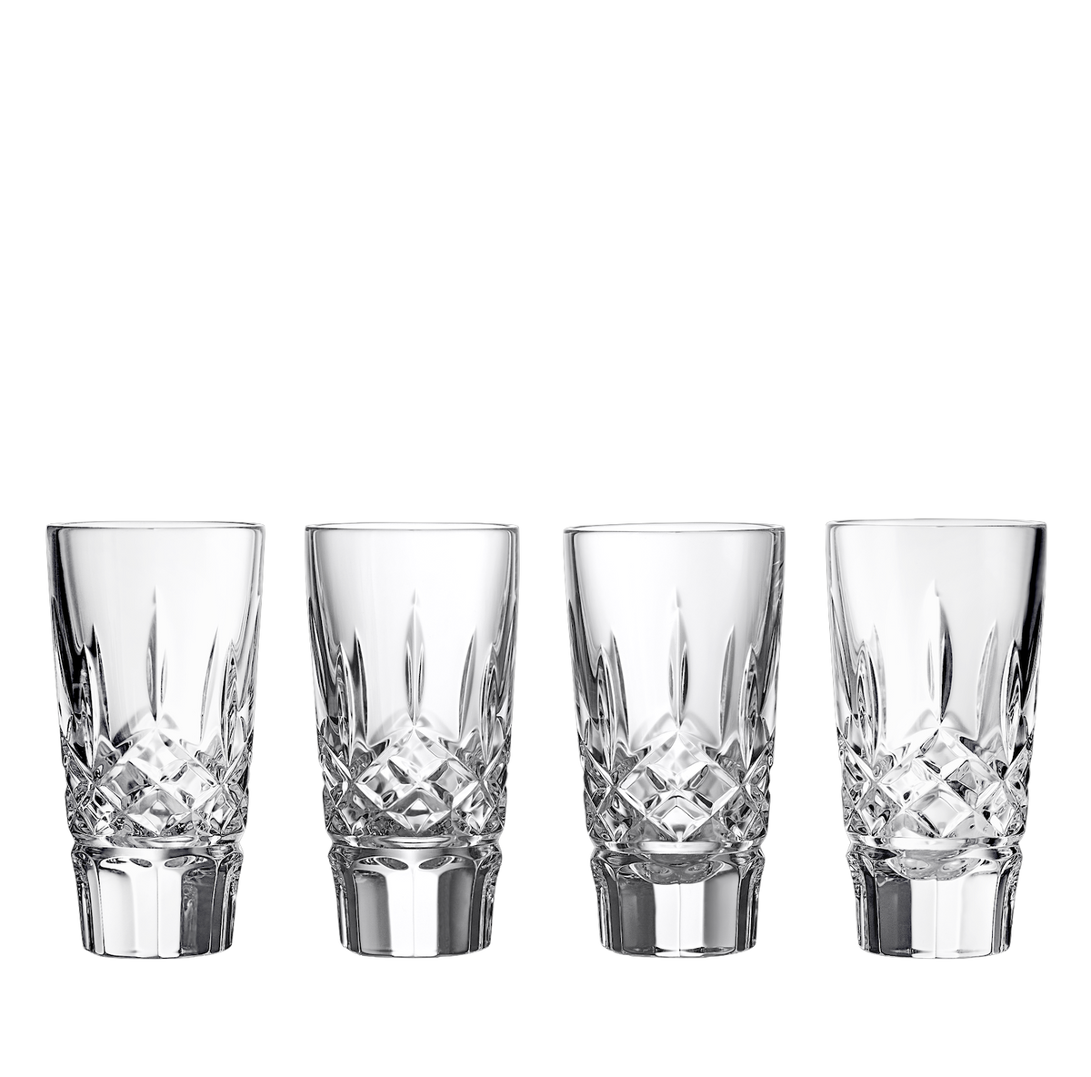 Front view of four Lismore crystal shot glasses showcasing faceted cuts with a black background
