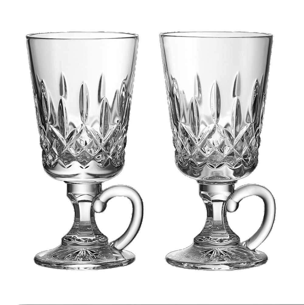 Front view of Lismore Irish coffee glasses showcasing hand-cut crystal pattern and pedestal handles on a black background