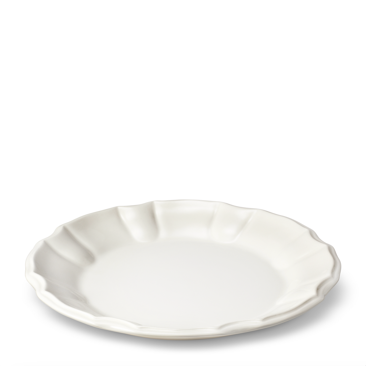 Three-quarter view of Arno Dinner Plate in Cream showcasing rosette-style trim with white background