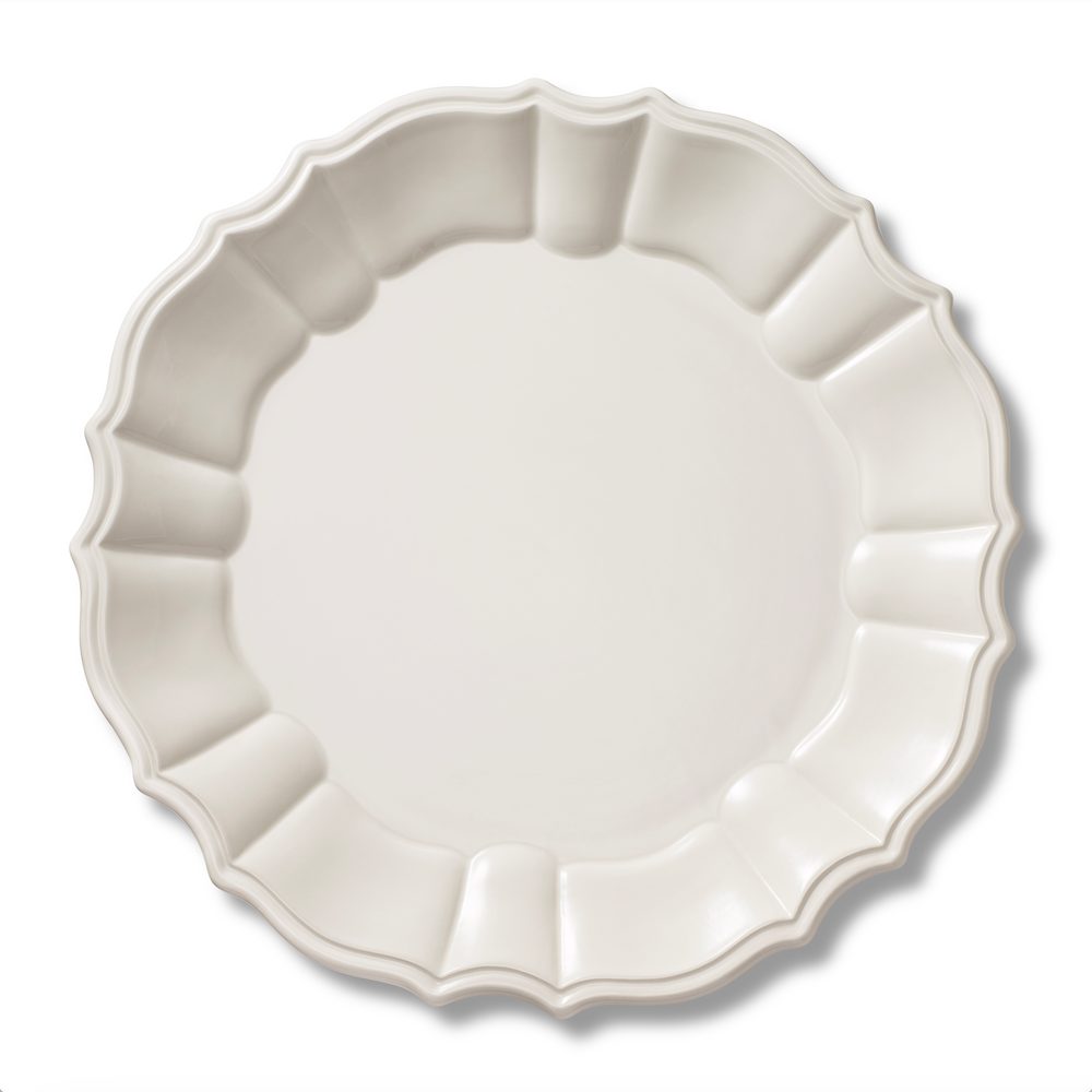 Top view of Arno Dinner Plate in Cream showcasing rosette-style trim with white background