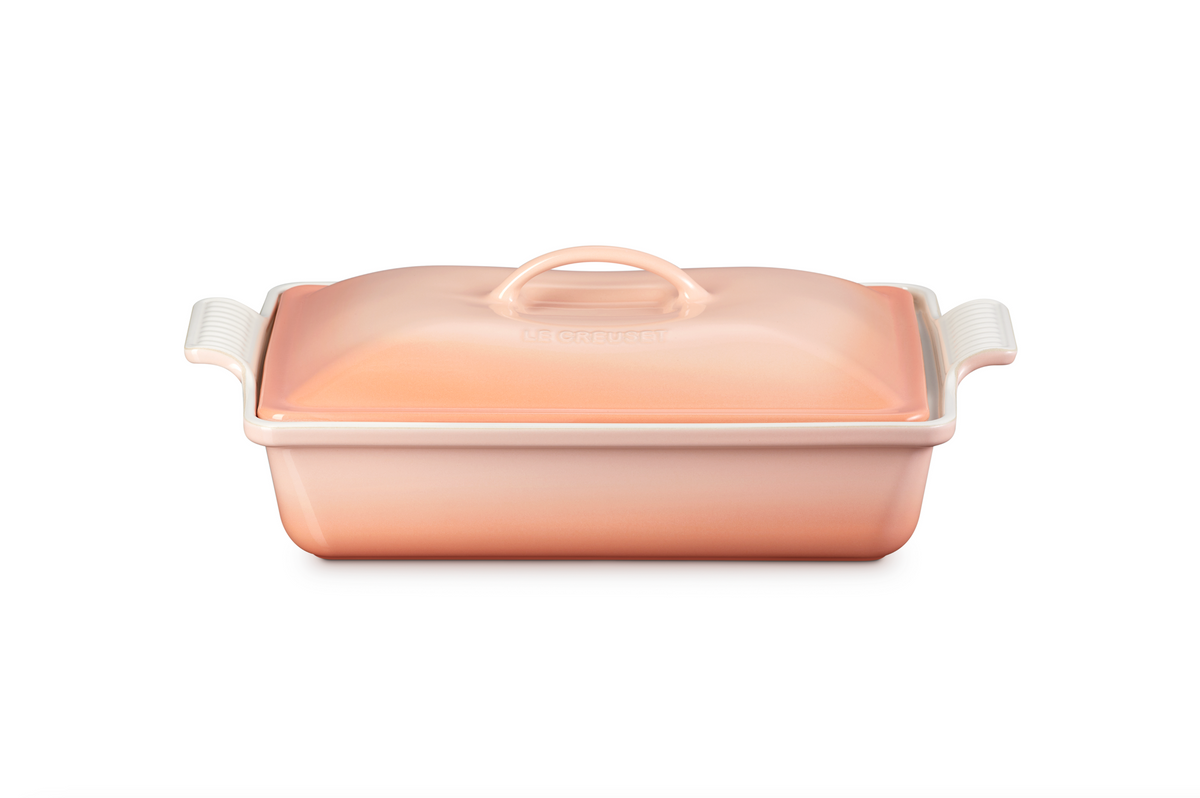 Front view of Heritage Covered Rectangular Casserole in Peche showcasing its covered design and side handles with a white background