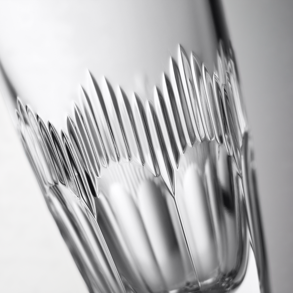 Angled close-up of Mixology mixer glass (710 ml, 24 fl oz) showcasing vertical cut crystal pattern on a pale gray background