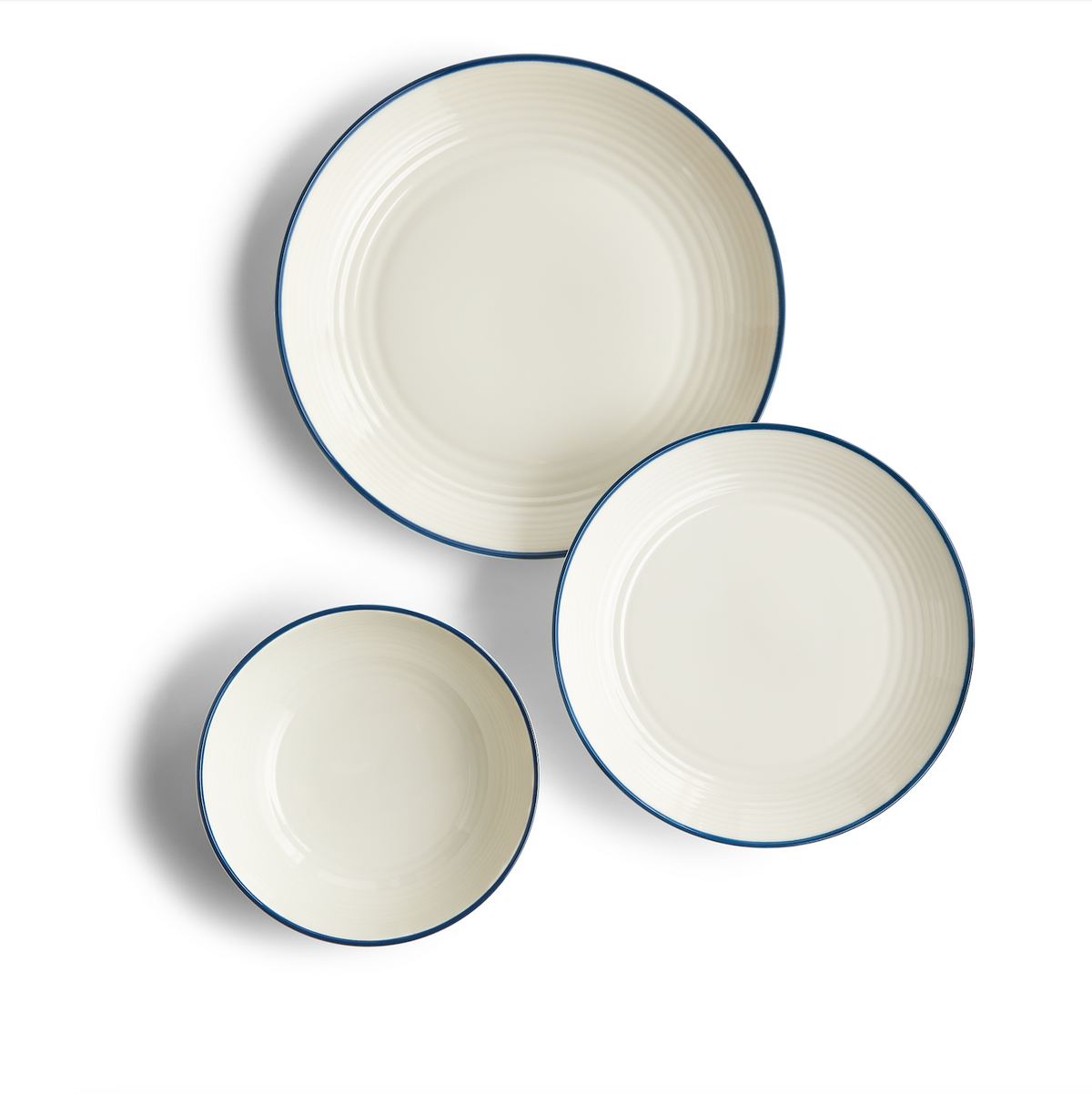 Top view of Gordon Ramsay Maze Denim Line 12 Piece Set showcasing white stoneware, circular design, and blue denim rims