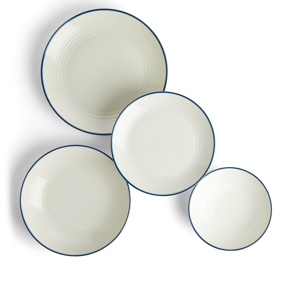 Top view of Gordon Ramsay Maze Denim Line dinner set showcasing white stoneware dishes with blue trim on white background