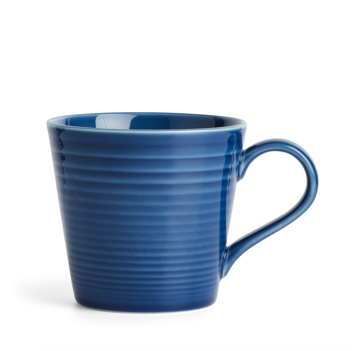 Front view of a Gordon Ramsay Maze Denim stoneware mug showcasing its ridged circular design and blue glaze on white