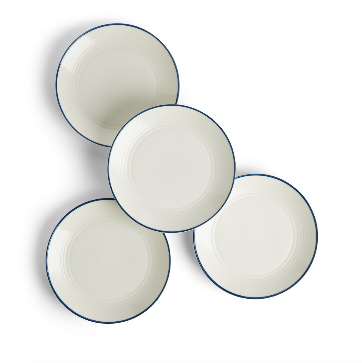 Front view of four Gordon Ramsay Maze Denim Line salad plates showcasing white stoneware, circular design, and blue rims on white