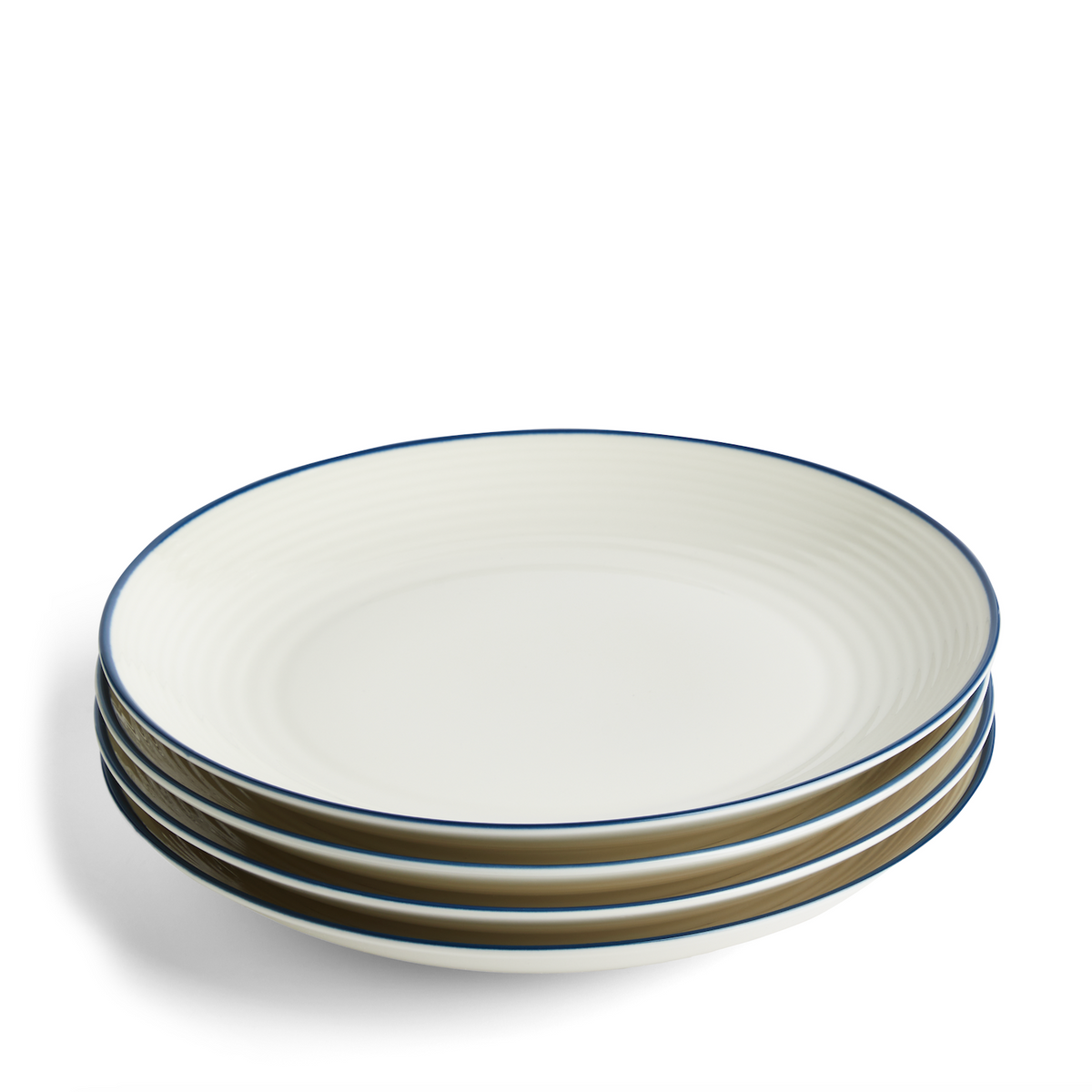 Angled view of four white stoneware salad plates showcasing Maze design and blue denim rims on white background