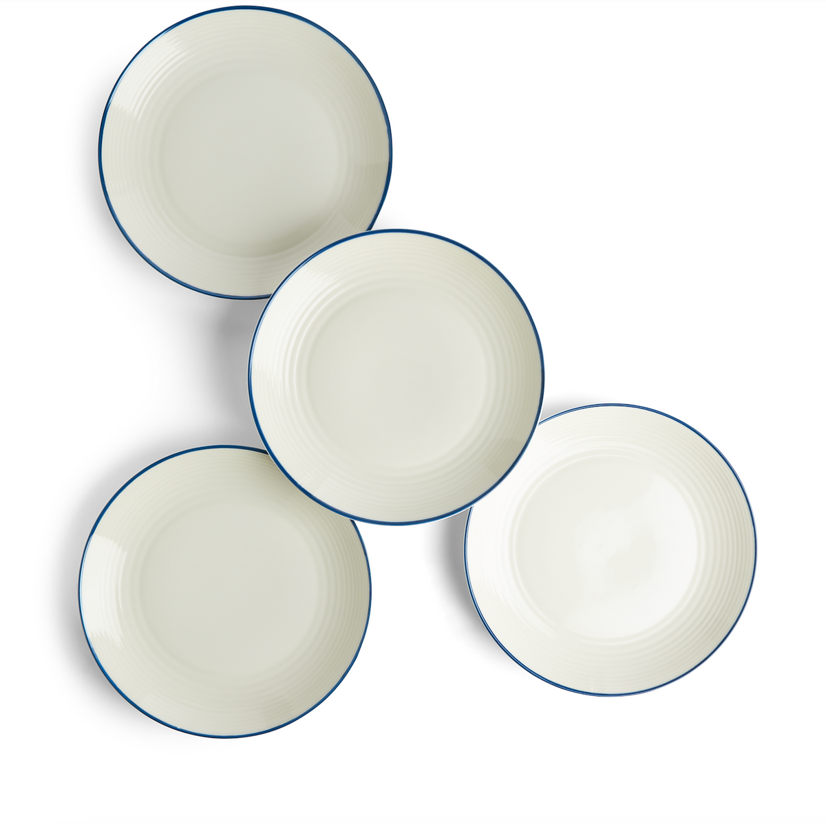 Overhead view of four Gordon Ramsay Maze Denim Line salad plates showcasing white stoneware, circular design, and blue rim on a white background