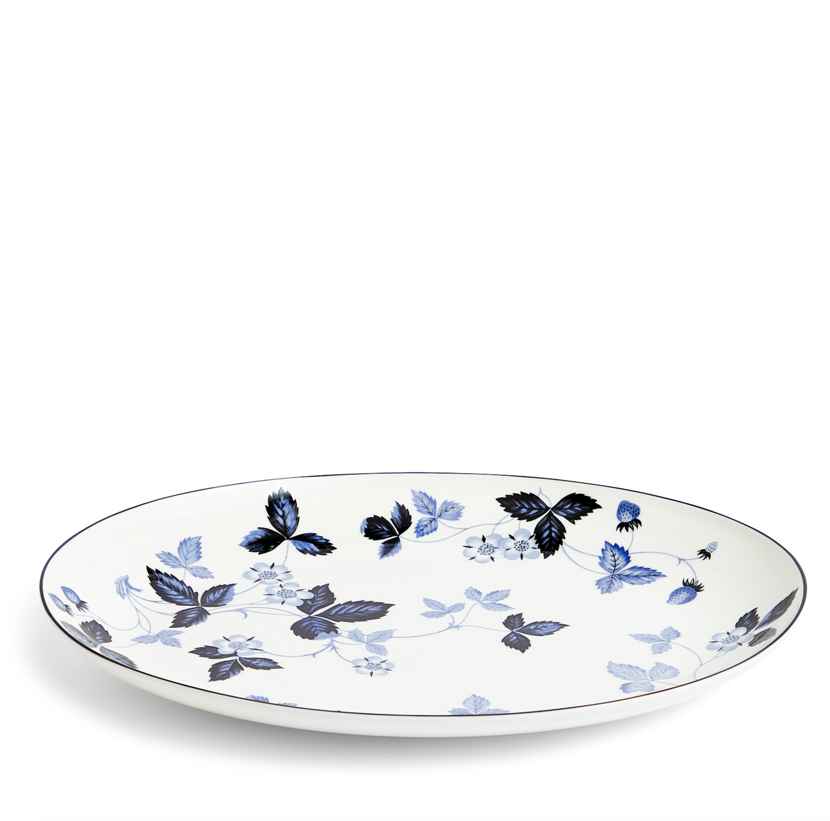 Angled view of Wild Strawberry Inky Blue Oval Serving Plate showcasing blue floral pattern on white fine bone china