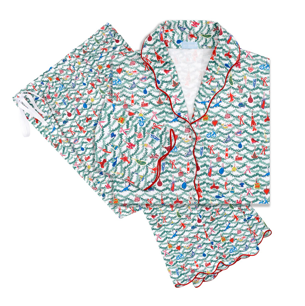 Top down view of Oh Christmas Tree women’s button front long pajama set showcasing holiday print on white background