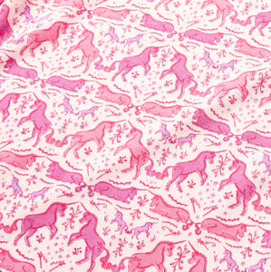 Close-up of unicorns kids pajamas showcasing pink unicorn print on white fabric